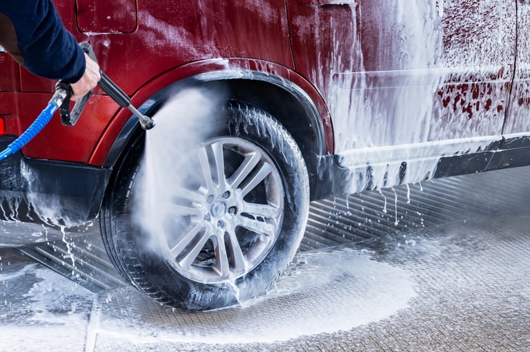 Red car wash with foam bubbles